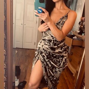 Dress with tags.  Silk style with a slit on one side.